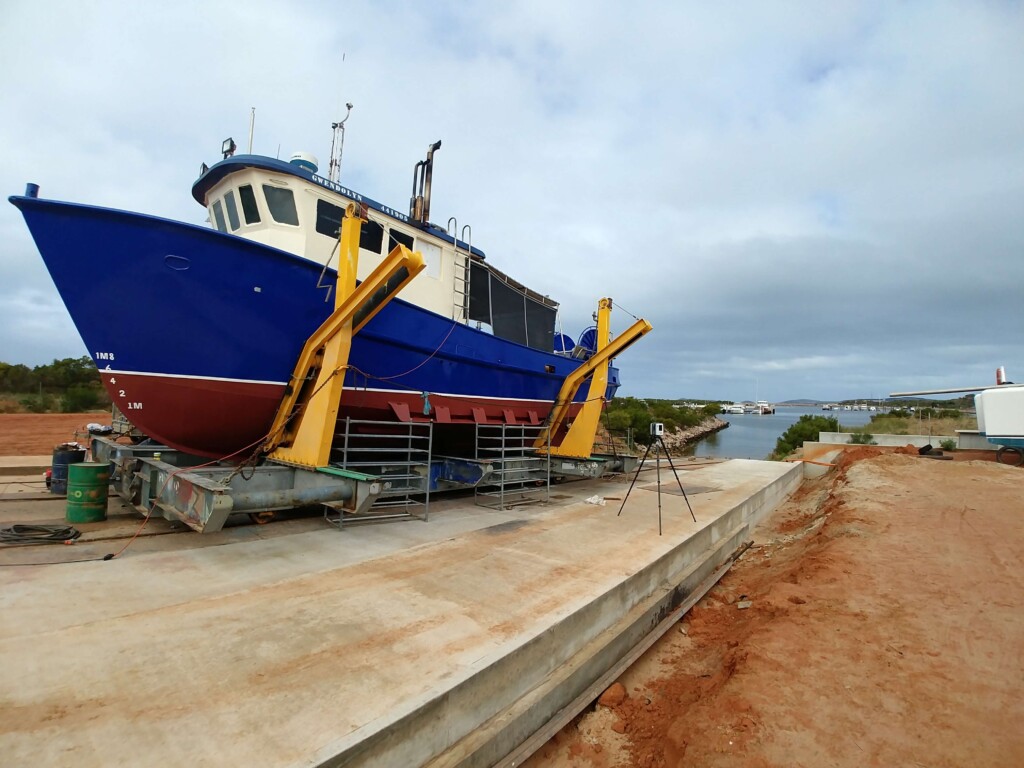A boat parked at a construction site.
