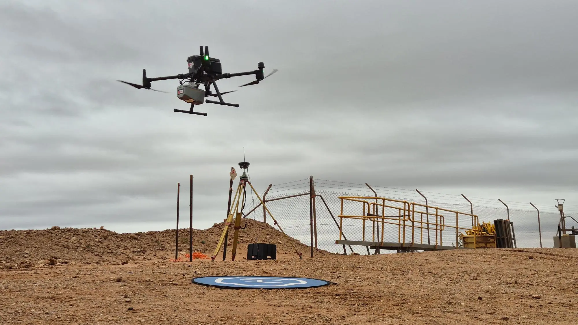 A drone surveying a geospatial site from above for mapping and data collection